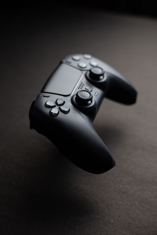 Black game controller, angled studio shot